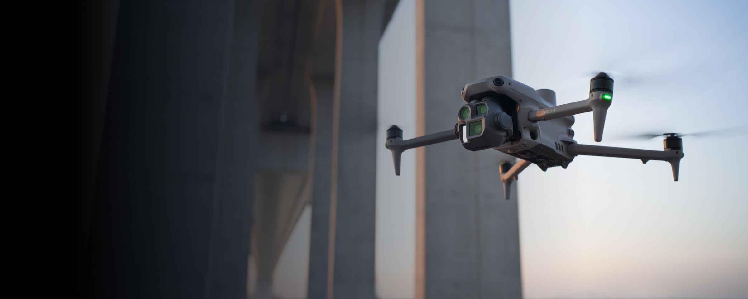 Compact DJI drone beside closely spaced bridge piers