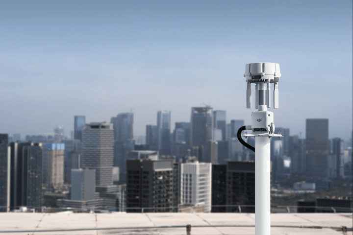 DJI O4 Ground Station installed on an elevated rooftop mast