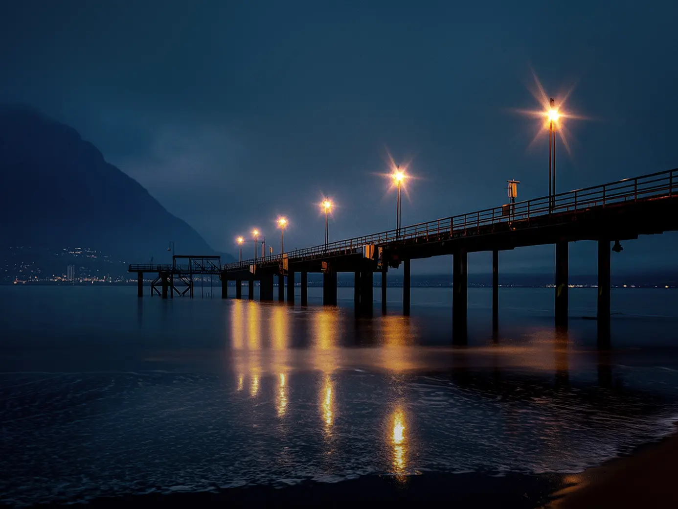 Night shot of boardwalk over the ocean