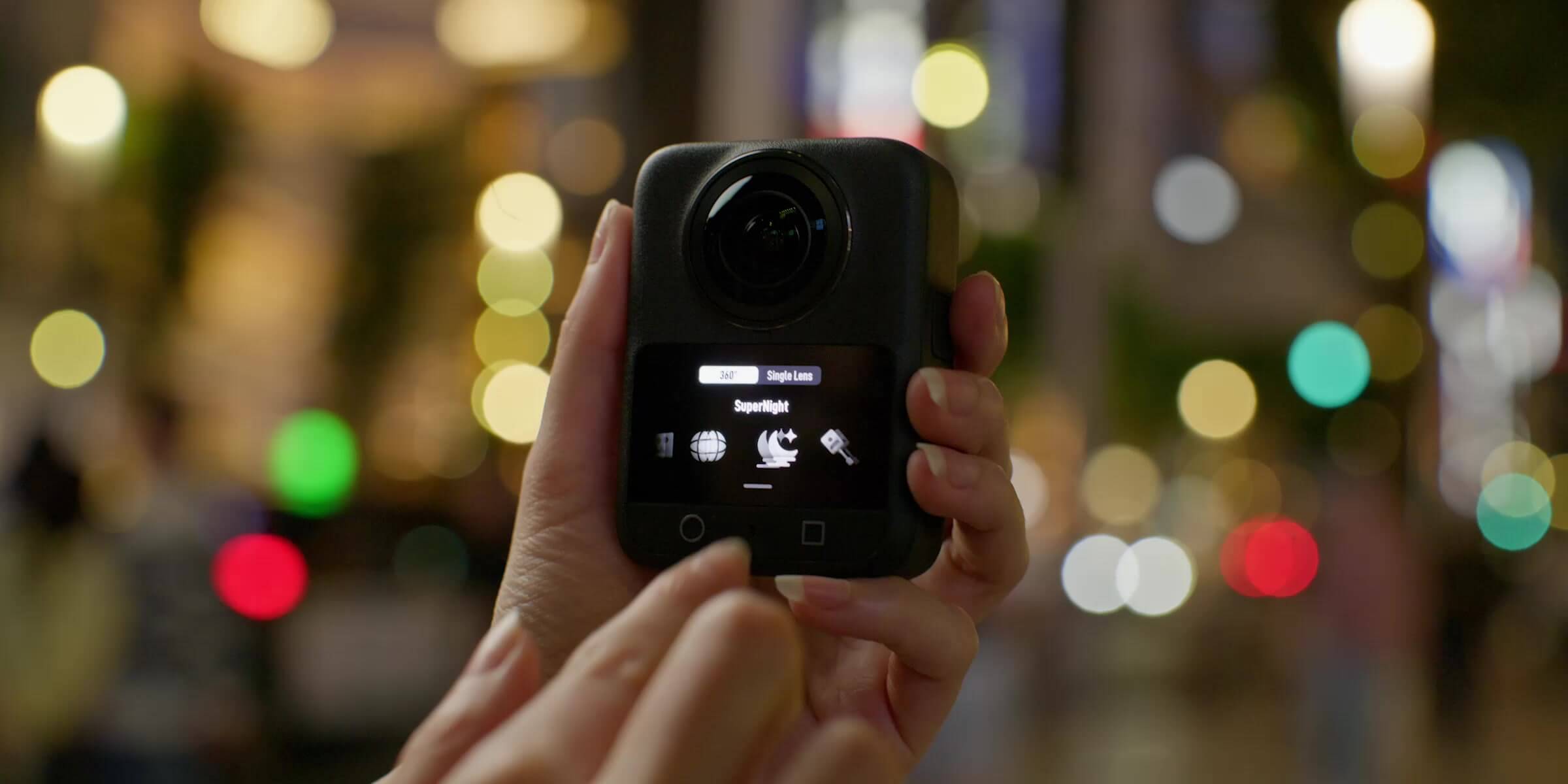 DJI Osmo 360 II screen showing the SuperNight mode in an illuminated city at night