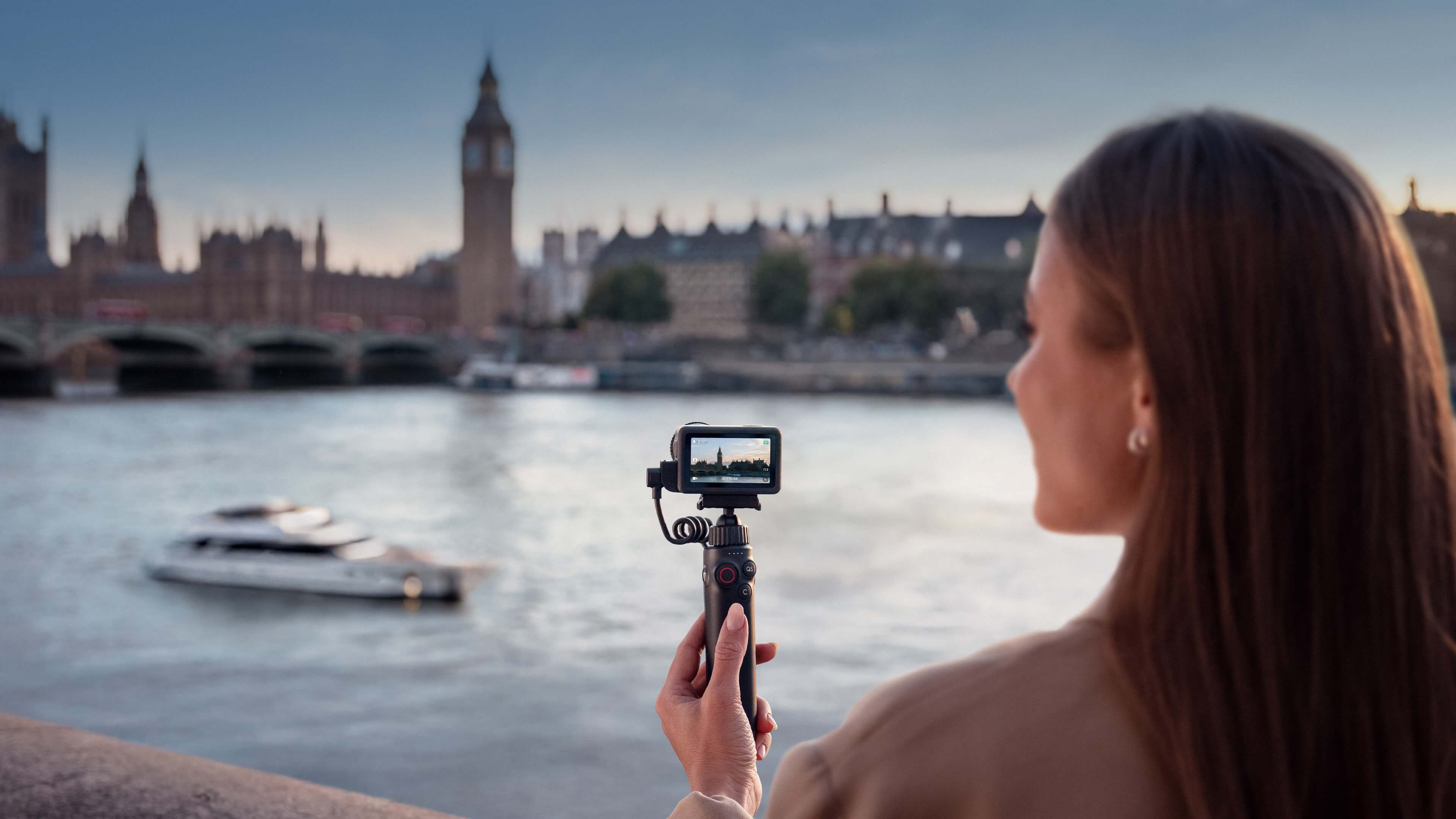 Creator filming with Osmo Action 6 beside the River Thames