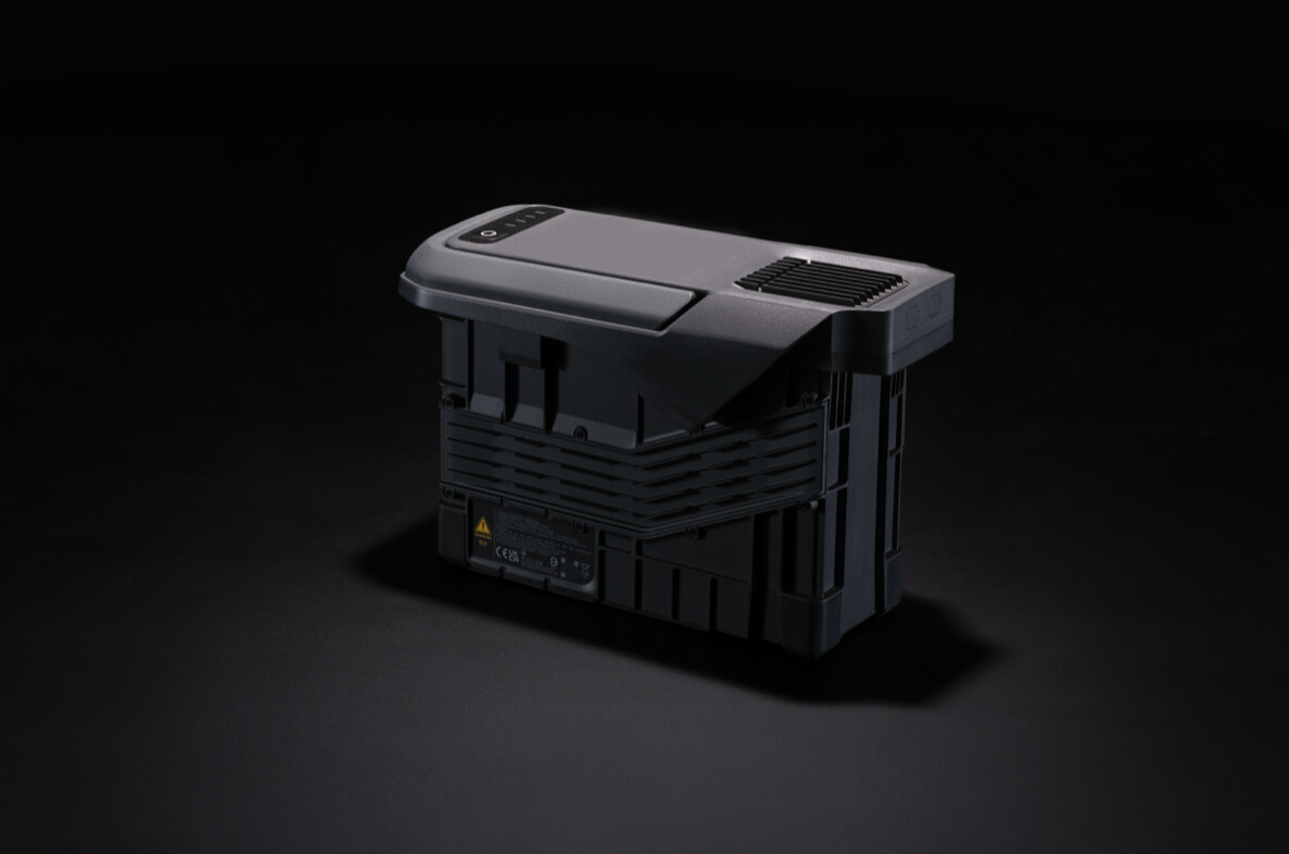 DJI's product image of the TB100 Intelligent Flight Battery, one pack shown from behind with its vents and contact rails