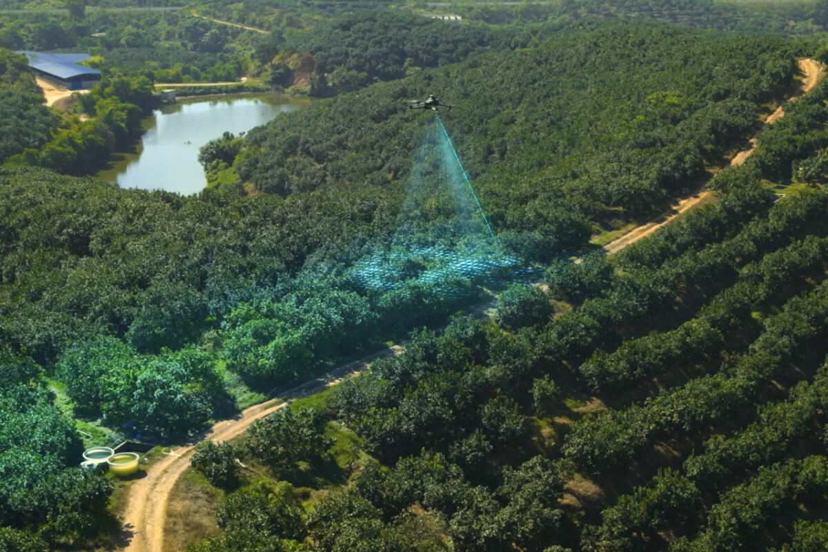 Official DJI orchard photograph showing Mavic 3M with a promotional terrain-sensing overlay