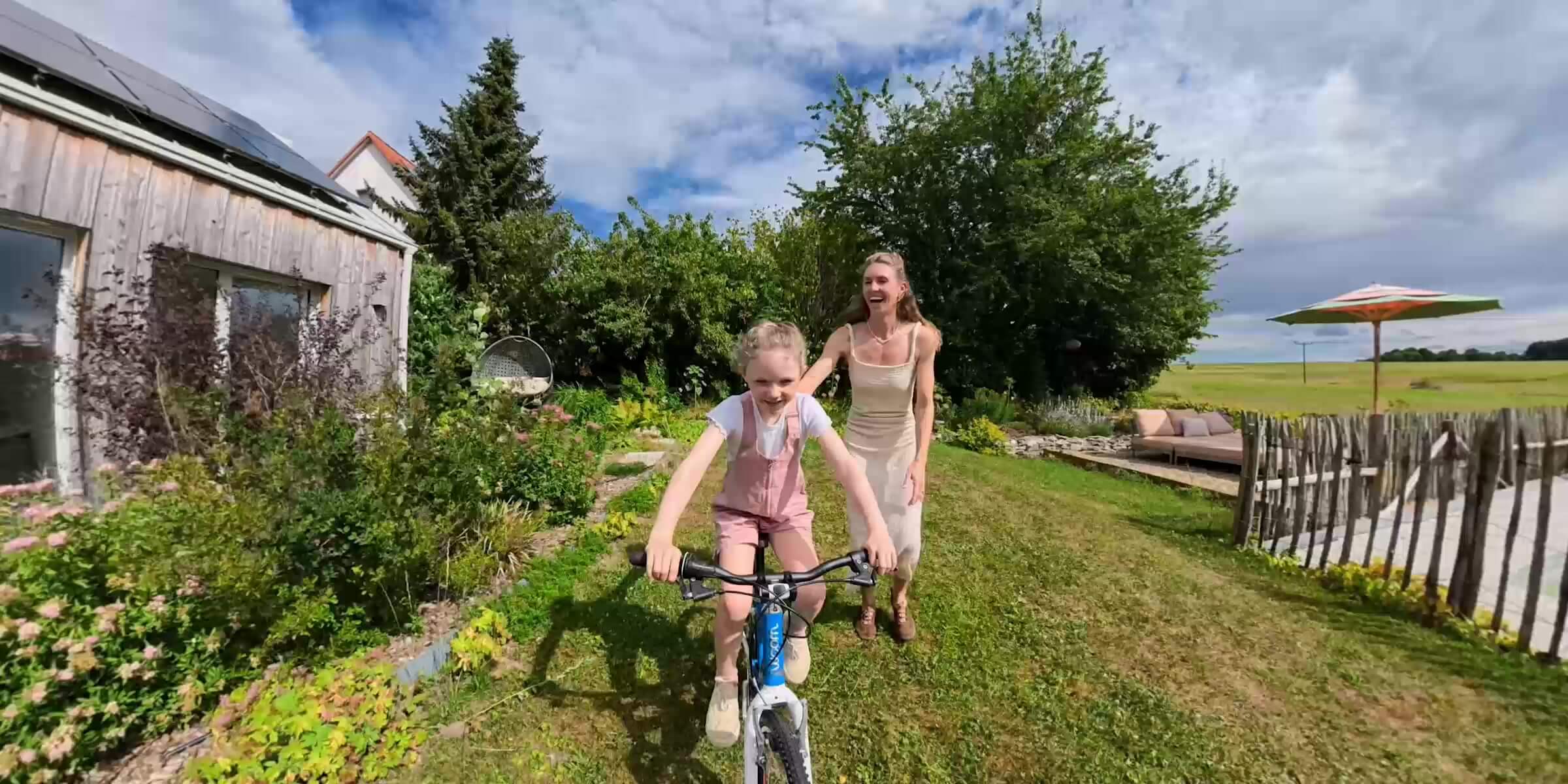 Child cycling toward a camera in a conventional flat action view