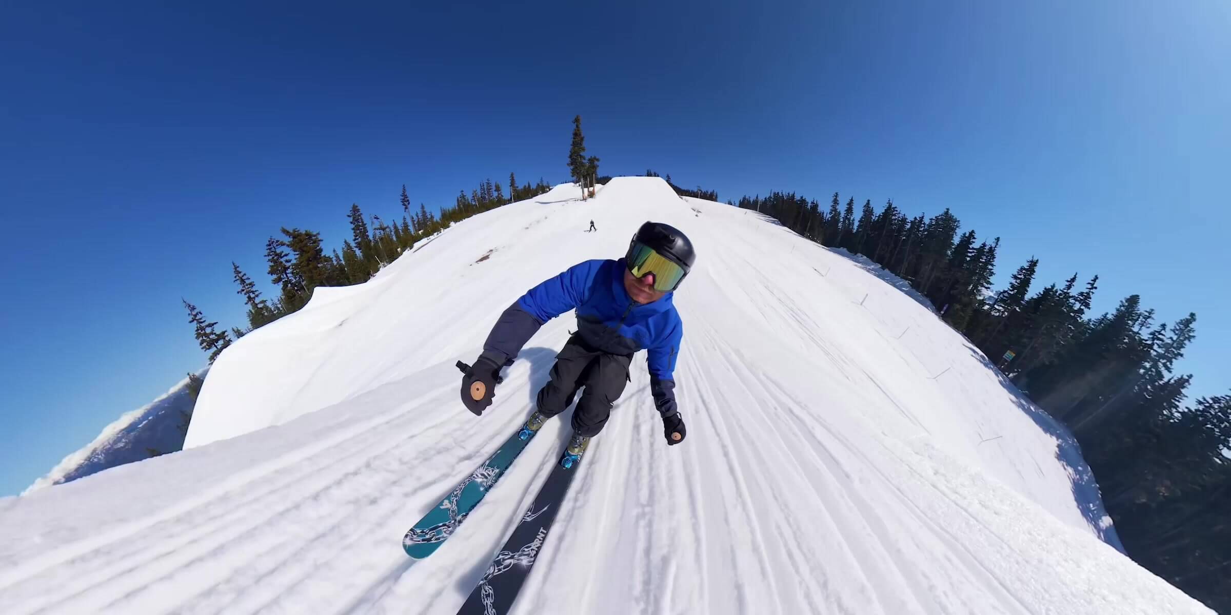 Skier carving across snow in DJI Osmo 360 II panoramic slow-motion promotional imagery