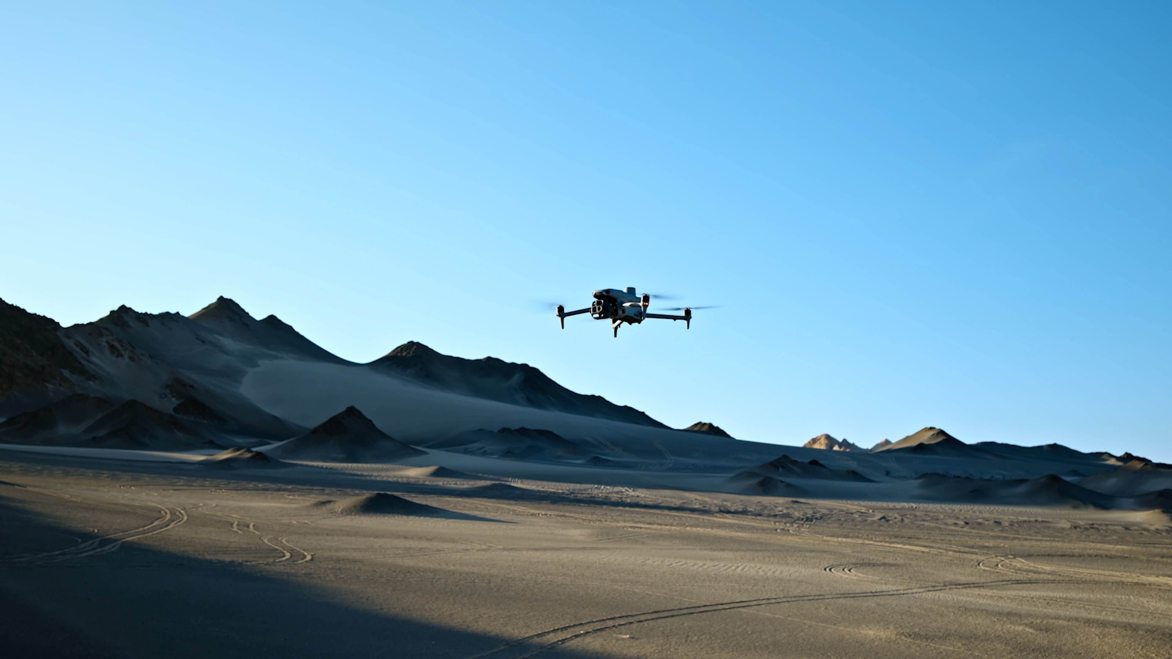 DJI Matrice 4E flying above open terrain