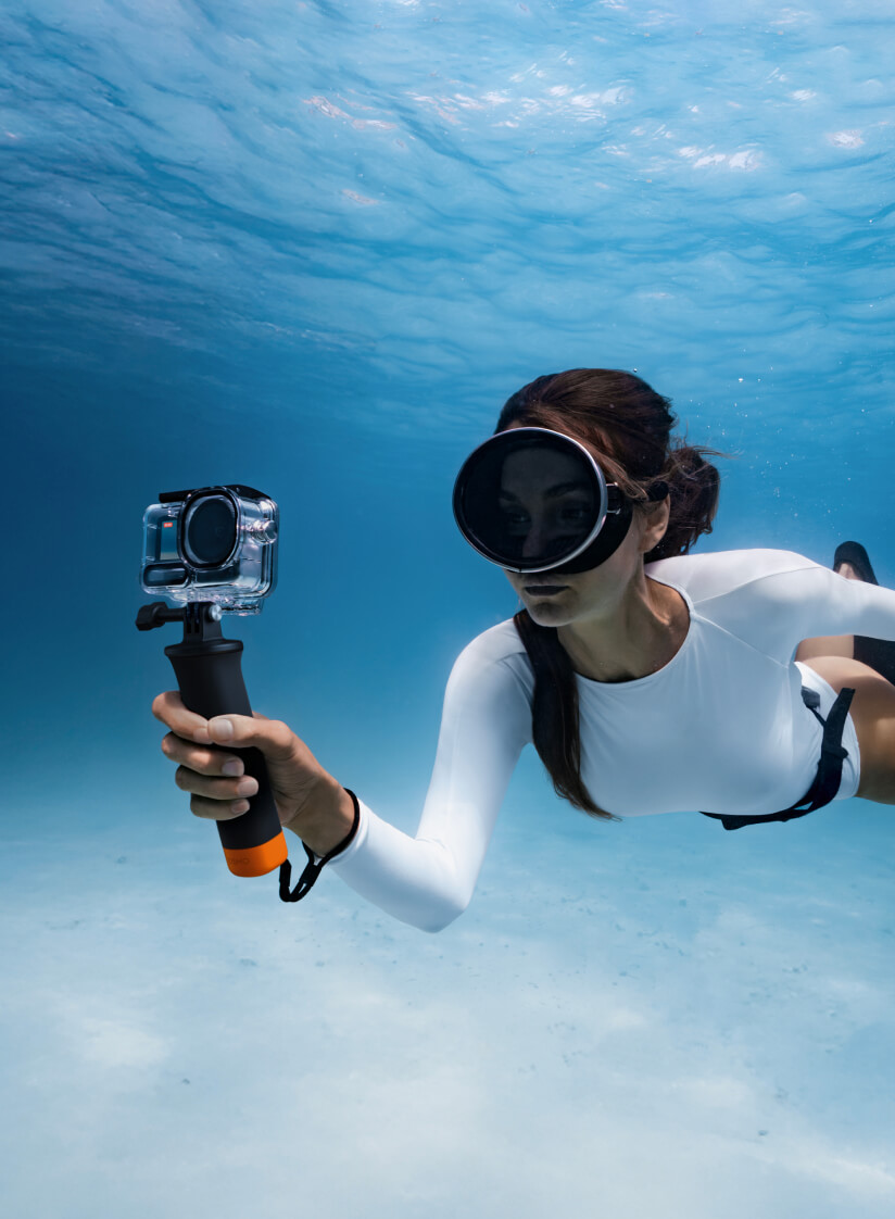 DJI Osmo Action 6 in use underwater, showing the variable aperture action camera in real shooting conditions for the Mission 1 Pro vs Action 6 comparison